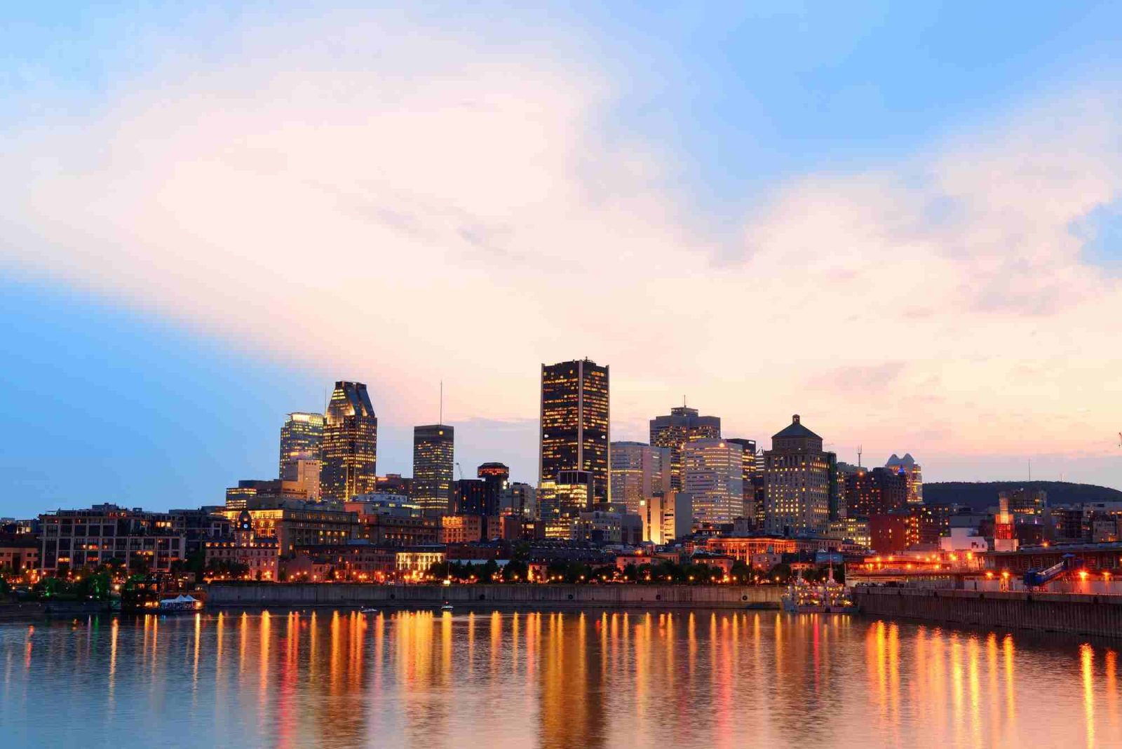 20230926151013 fpdl.in montreal river sunset with city lights urban buildings 649448 4530 full 1
